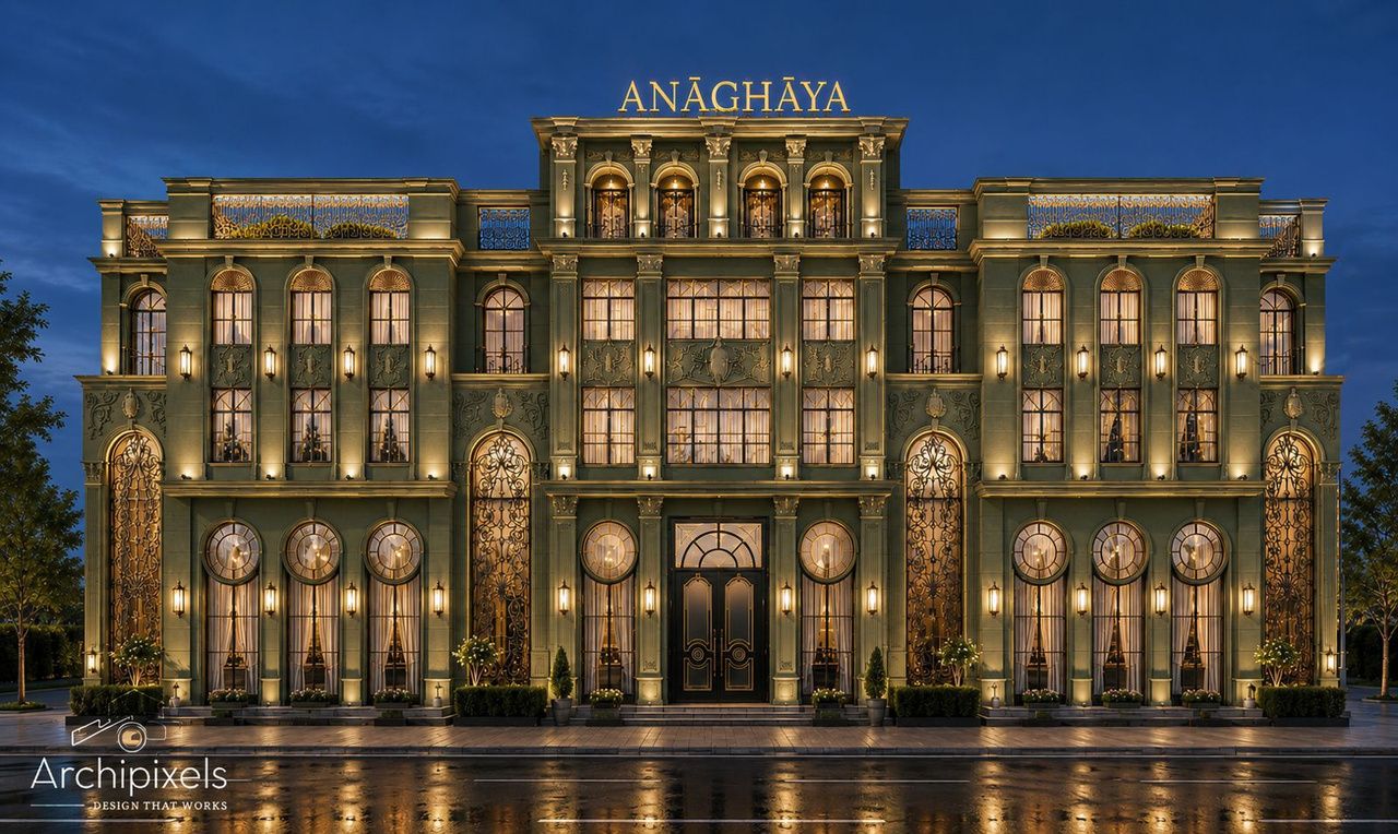 The Deco Grand hotel facade lit at night