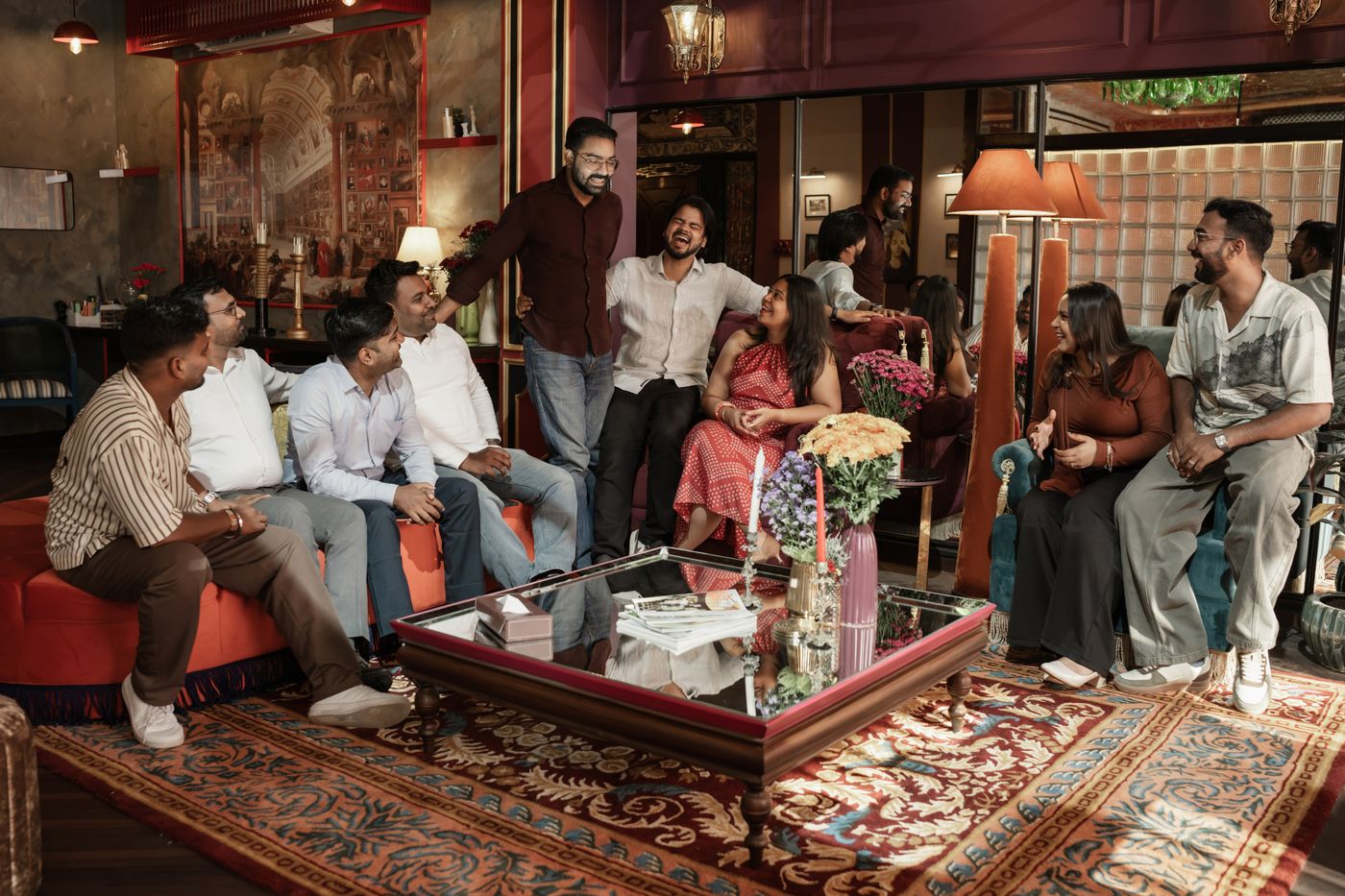 The Archipixels team gathered around a coffee table